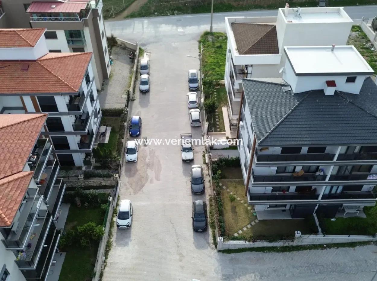 Neue 11-Wohnung Zum Verkauf Mit Offener Fassade, Grossem Balkon Und Garderobe In Seferihisar Camike