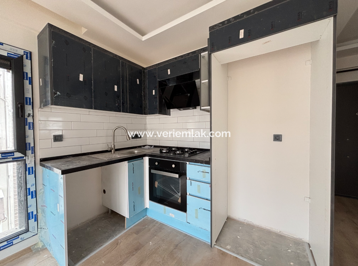 2 1 Apartment With Large Balcony For Sale Near The Main Street In Seferihisar Camikebir Neighborhood