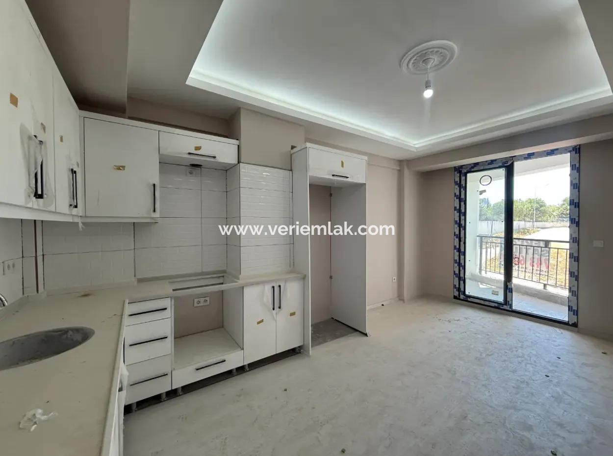 Near Seferihisar State Hospital, New, 1 1 Flat For Sale – With Indoor Parking, Balcony And Central Location