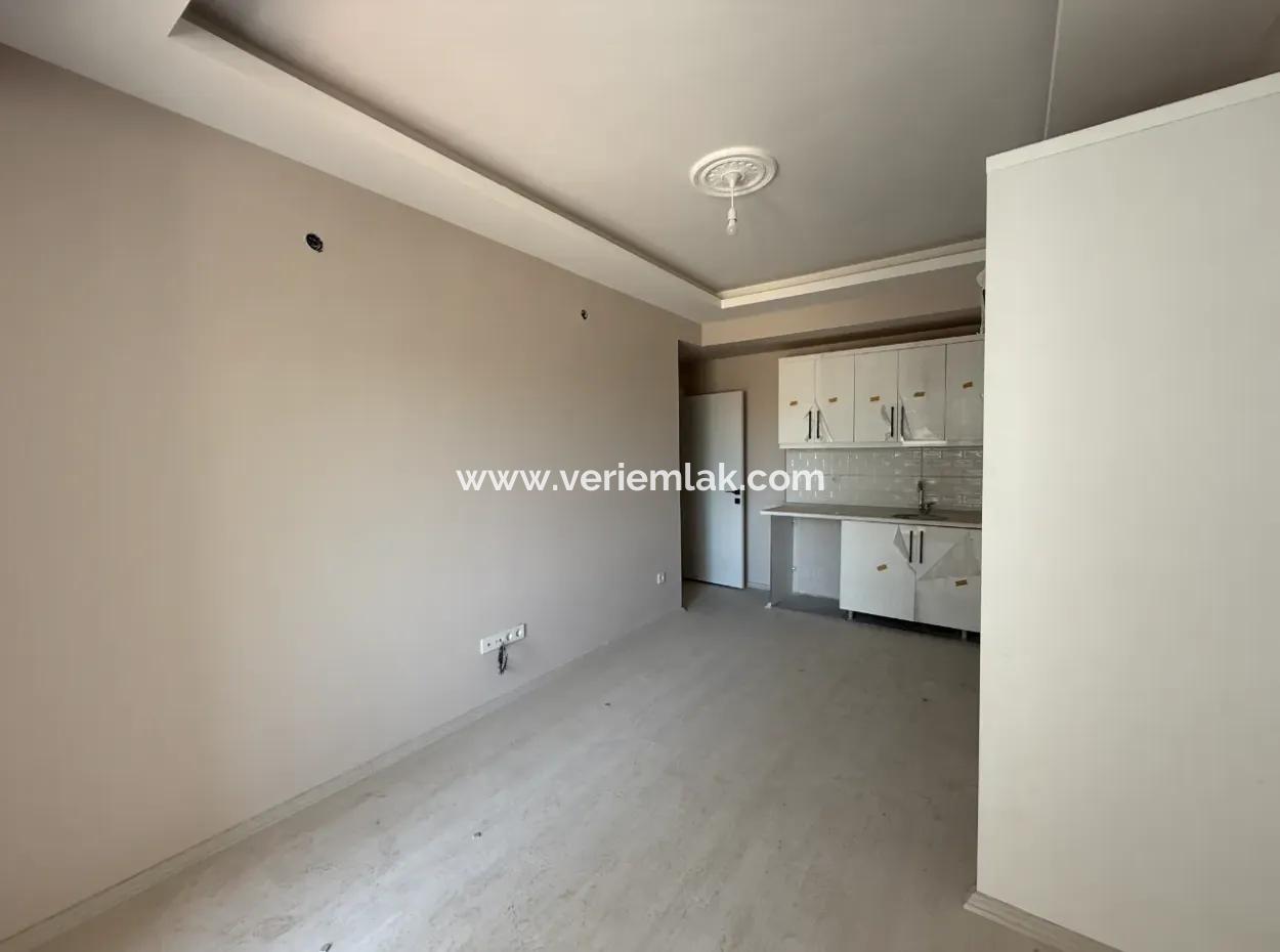 Near Seferihisar State Hospital, New, 1 1 Flat For Sale – With Indoor Parking, Balcony And Central Location