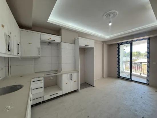 Near Seferihisar State Hospital, New, 1 1 Flat For Sale – With Indoor Parking, Balcony And Central Location