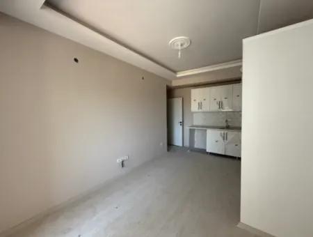 Near Seferihisar State Hospital, New, 1 1 Flat For Sale – With Indoor Parking, Balcony And Central Location